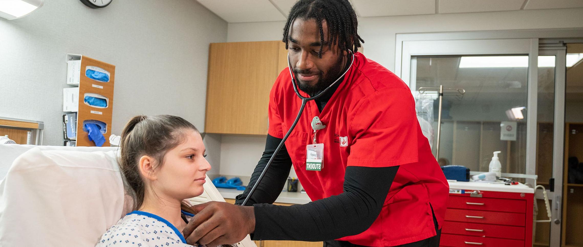 Carthage College in Wisconsin offers a nursing major. Pictured here is a nursing student listening to a person's heart rate in the simula...